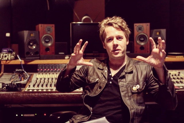 A music supervisor with headphones and notes